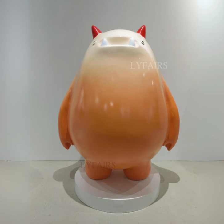 Adorable Orange Monster Sculpture